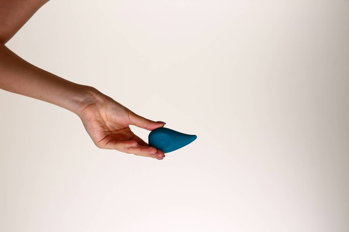 clean makeup application sponge next to foundation bottle showing minimal product use
